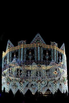 Illuminated structure glows against dark night sky Stock Photos