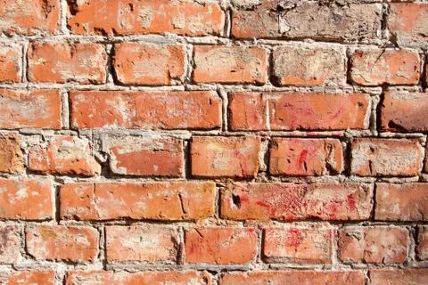 Illuminated by the sun the old brick wall background Stock Photos