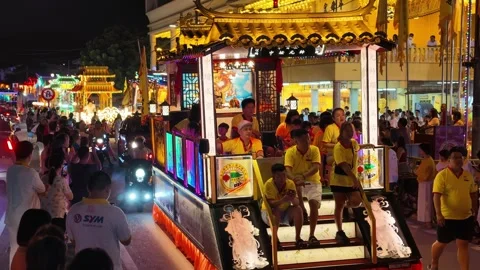Illuminated temple float parade during nine emperor gods festival Stock Footage 347894598