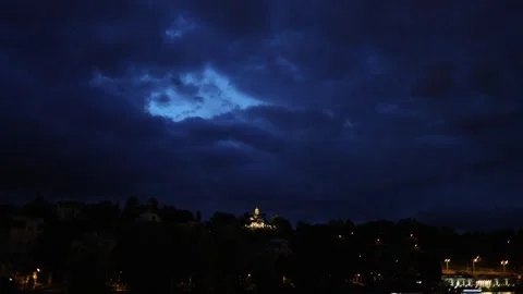 Illuminated temple under storm clouds Stock Footage 335921702