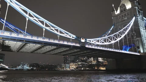 Illuminated Tower Bridge at night with reflections on the River Thames. Stock Footage 297119787