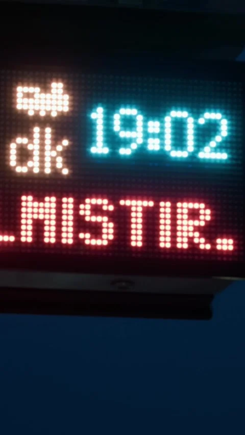 Illuminated tram stop illuminated arrival board at night in Istanbul Video stock 328387428