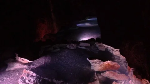 Illuminated Underground River in a Dark Red Cave Qızıl Qoba , Crimea 2 Stock Footage 82299137