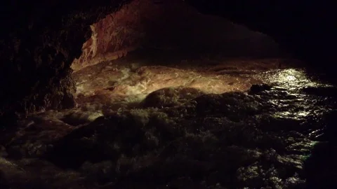 Illuminated Underground River in a Dark Red Cave Qızıl Qoba , Crimea 3 Stock Footage 82299158