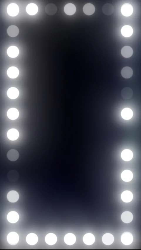 Illuminated vanity mirror frame with round bulbs and empty dark center, bea.. Stock Footage 328354824