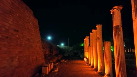 Illuminated view of historical columns in the ancient city of Asklepion, the Stock-Footage 241797631