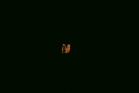 Illuminated Window Glowing in the Dark 스톡 사진