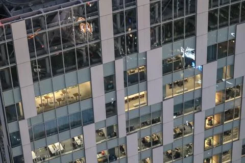 Illuminated Windows Showcasing Evening Workflow Dec 4 2024 Stock Photos