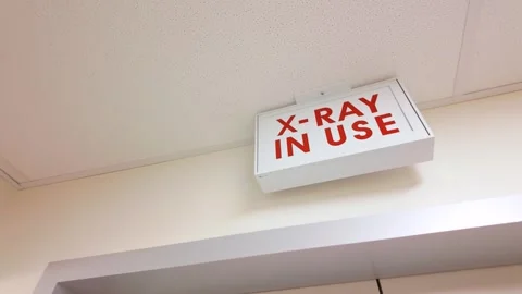 Illuminated X-Ray In Use warning sign in a hospital Stock Footage 331968044