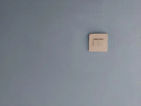 Illuminating Control: A Gleaming Light Switch Stock Photos