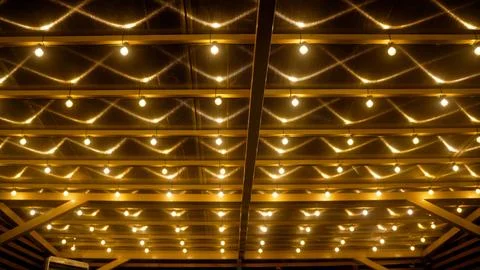 Illuminating light bulbs activating in sequence. Stock Photos