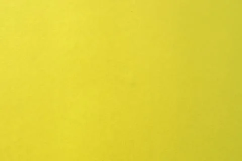 Illuminating yellow background with simple surface. Stock Photos