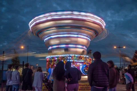 Illuminations in attraction park with carousel Stock Photos