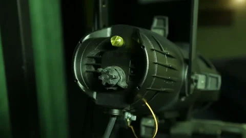 The illuminator in gloves removes the cover with a halogen lamp from the profile Stock Footage 103860002