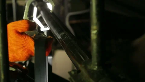 The illuminator hangs the mount with a profile spotlight on the beam Stock Footage 103222795