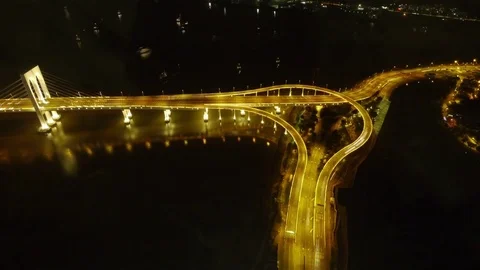 Illuminiated Sai Van Bridge and Highway Stack Interchange in Macau at Night Stock Footage 82843897