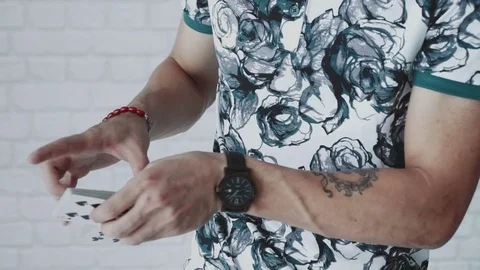 Illusionist hands showing tricks with playing cards Stock Footage 79767564