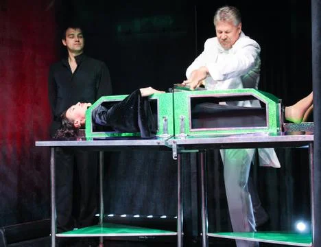 The illusionist inserts the partitions. Stock Photos