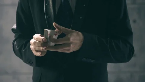 Illusionist performing card trick Stock Footage 83798579