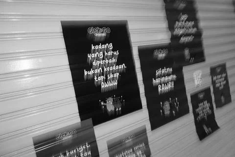 Illustrated Quote Posters on Shutter Wall Stock Photos