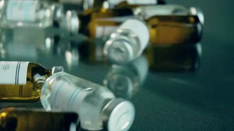 Illustration drug development process, vials or bottles with metal lids full of Stock Footage 152504987