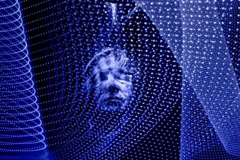 Illustration of a face with lighting effects. Artificial intelligence face. Photos