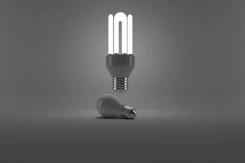 Illustration of lit energy efficient lightbulb over bulb Illustrazione stock