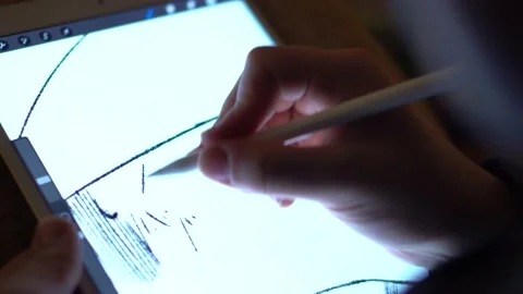 The illustrator sketching on the tablet at night Stock Footage