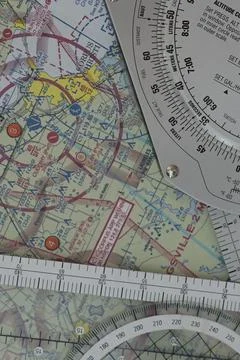 Ilot plots a flight on a sectional map for a vector from one airport to another. Fotos de archivo