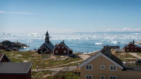 Ilulissat, Greenland - July 16 2019: Town view with icebergs Stock Photos