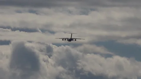 Ilyushin Il-76TD Cargo Plane Flying Through Clouds Stock Footage 341773330