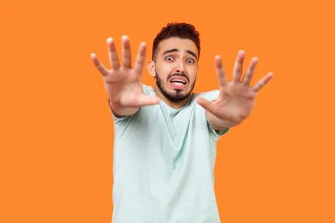 I'm afraid! Portrait of scared terrified brunette man making frightened gestu Stock-Fotos