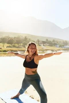 Im a better me when I do yoga. a beautiful young woman practising yoga on the Stock Photos