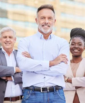 Im in charge of the best team. a diverse group of businesspeople standing Stock Photos