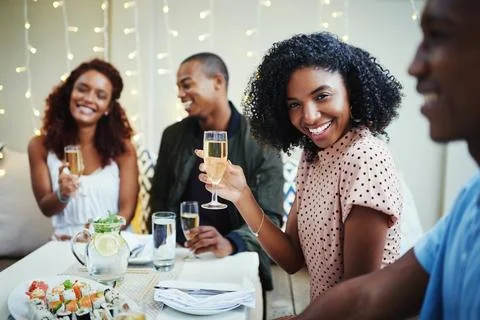 Im having so much fun with my friends. a group of young friends enjoying a night Stock Photos