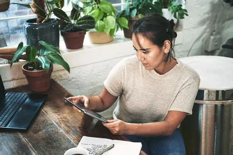 Im looking for something specific. an attractive young business owner sitting Stock Photos