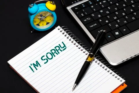 I'm sorry text concept write on notebook Stock Photos