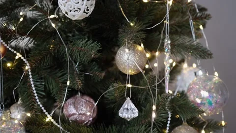 I'm taking the decorations off the Christmas tree. New Year's Eve and holid.. Stock Footage 228679977