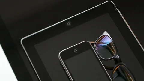 IMac, iPad tablet, iPhone 3gs and eyewear Stock Footage 107783752