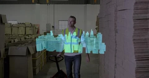 Image of 3d city model and icons over caucasian warehouse worker Foto stock