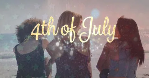 Image of 4th of july text and light spots over diverse friends at beach 스톡 사진