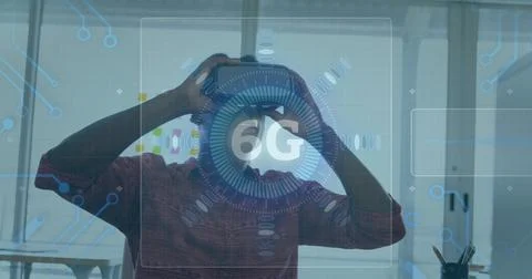 Image of 6g text, scope scanning and circuit board elements over man wearing vr Stock Photos