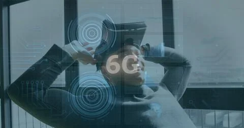 Image of 6g text, scopes scanning and data processing over smiling man wearing Stock Photos