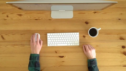 Image from above of left-hand man working from home during the day. Stock Footage 128773505