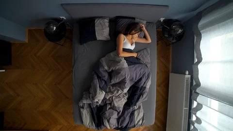 Image from above of man going to sleep with girlfriend during the morning. Stock Footage 119222148