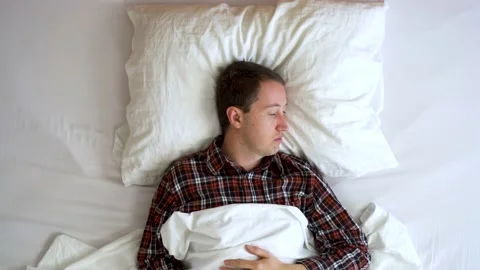Image from above of your man waking up during morning. Stock Footage 132182665