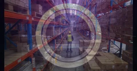 Image of abstract circular shape over male worker riding on segway at warehouse Stock Photos