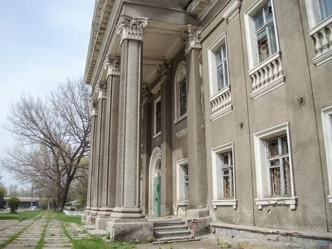 Image of an aged, classical building with a symmetrical facade featuring Cori Stock Photos