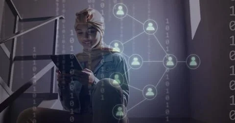 Image of ai binary coding and data over biracial female student using tablet Foto stock