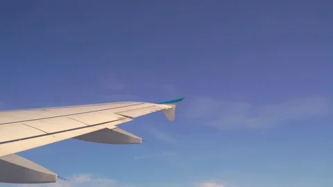 Image of airplane wing flying over a cloudy day. Video stock 127217291